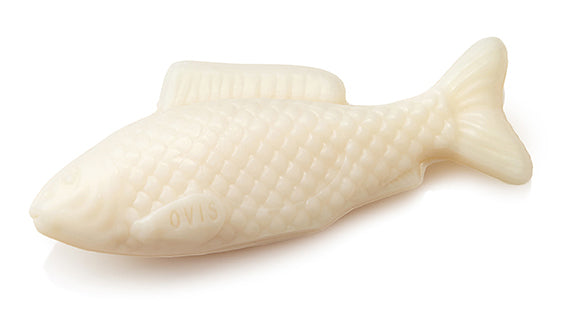 A fish-shaped soap in creamy off-white color.