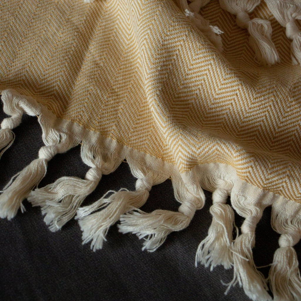 Anza Mustard Herringbone Throw fabric closeup
