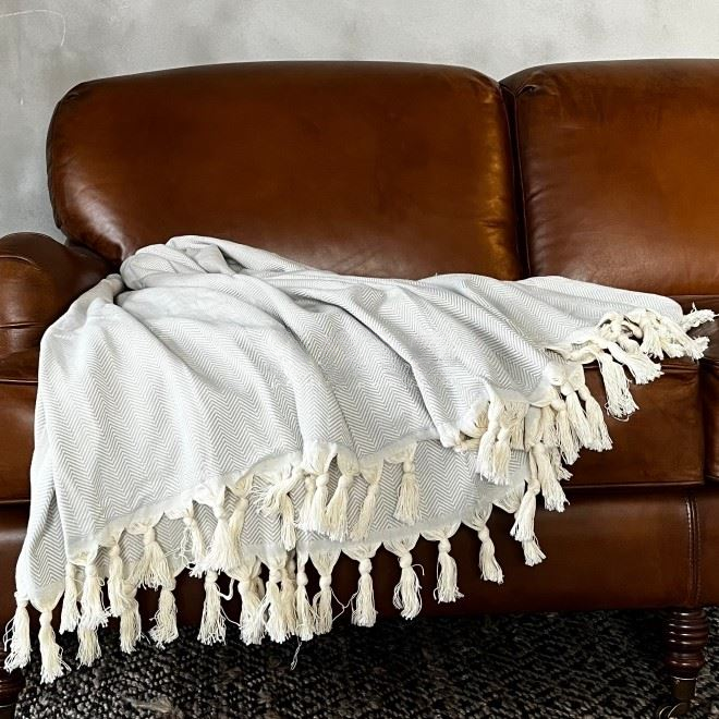 Anza Silver Grey Herringbone Throw on sofa