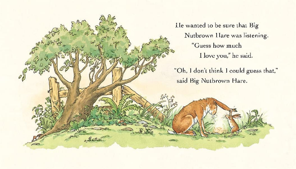 Inner page of 'Guess How Much I Love You', watercolor illustration of a small brown rabbit holding a big brown rabbit by its ears in front of a tree.