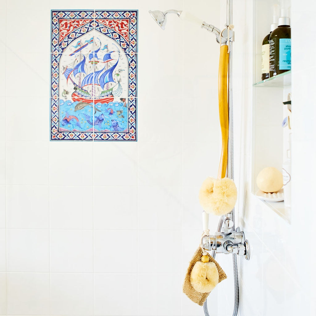Eco Max Soft Bristle Body Brush hanging on bathtub faucet