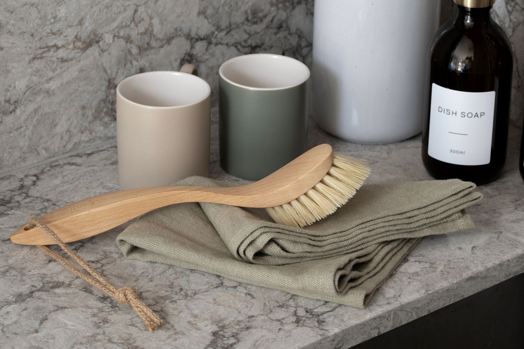 Natural by Hillbrush Stiff Dish Brush on the side of kitchen sink