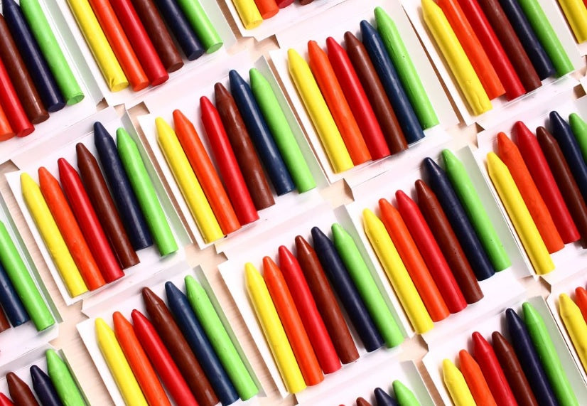 Sets of Colorz Natural Beeswax Crayons arranged in a diagonal grid pattern.