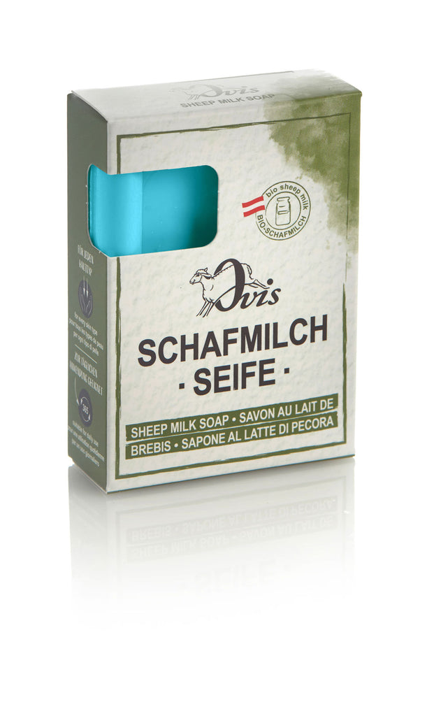 Box of Ovis sheep milk soap with part of the blue soap bar visible.