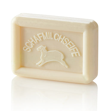 Rectangular off-white soap bar with a sheep and "SCHAFMILCHSEIFE" embossed on it.