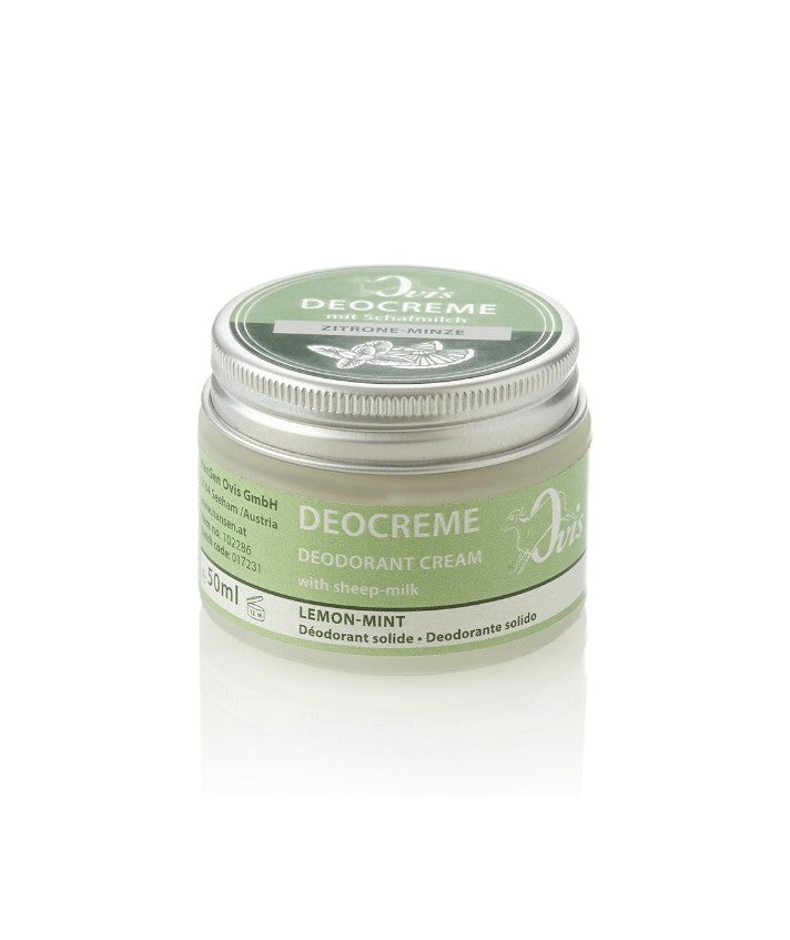 A glass jar of lemon mint deodorant cream with a green label and silver lid.
