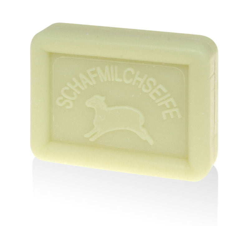 Rectangular light lime green soap bar with a sheep and "SCHAFMILCHSEIFE" embossed on it.