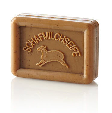 Rectangular brown soap bar with a sheep and "SCHAFMILCHSEIFE" embossed on it.