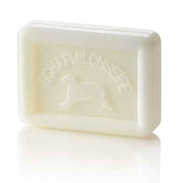 Rectangular white soap bar with a sheep and "SCHAFMILCHSEIFE" embossed on it.