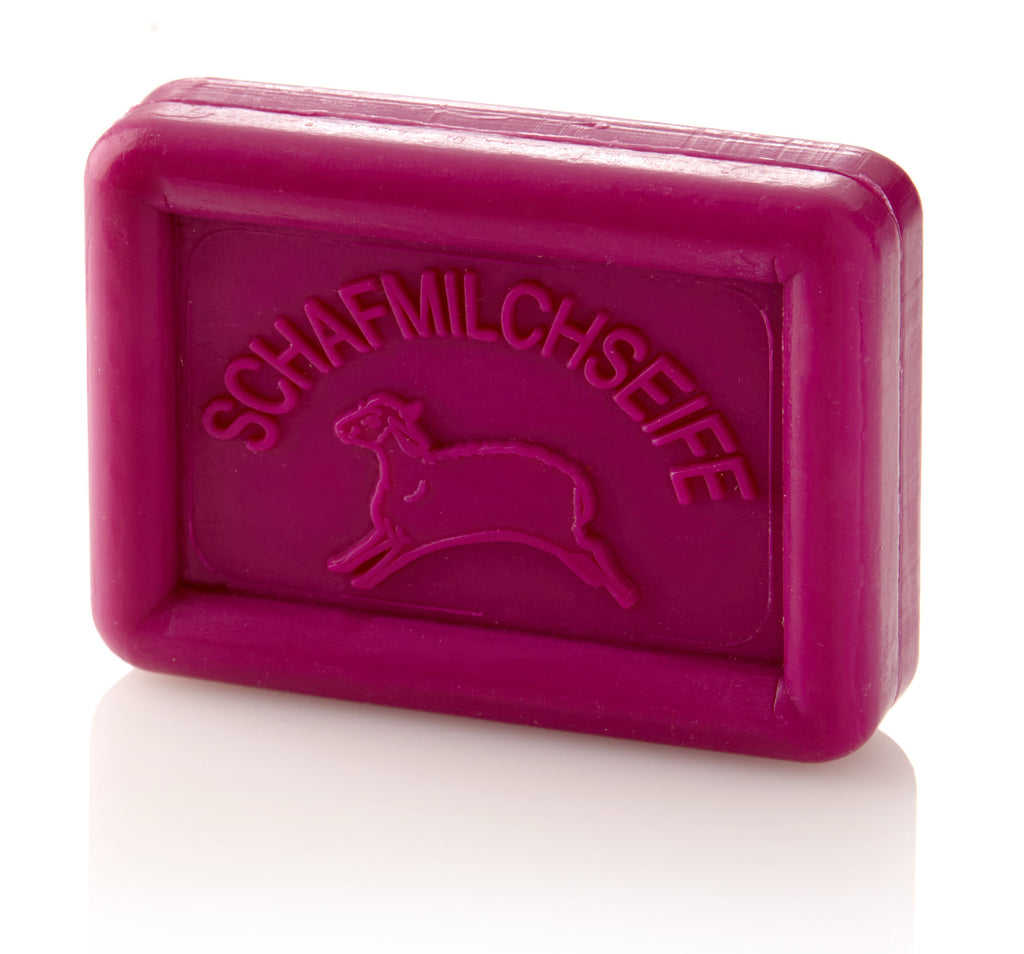 Rectangular magenta soap bar with a sheep and "SCHAFMILCHSEIFE" embossed on it.