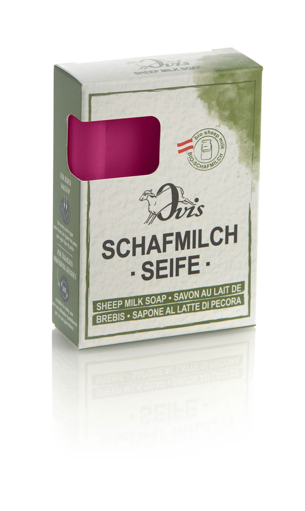 Box of Ovis sheep milk soap with part of the magenta soap bar visible.