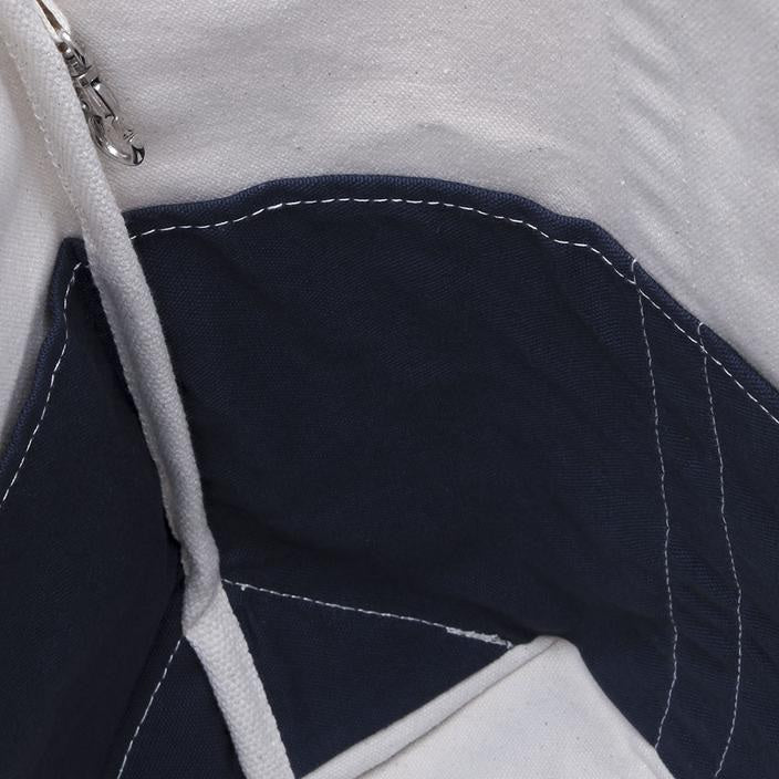 Interior view of ShoreBags Contemporary Canvas Tote bag with dark blue and white materials and visible stitching.