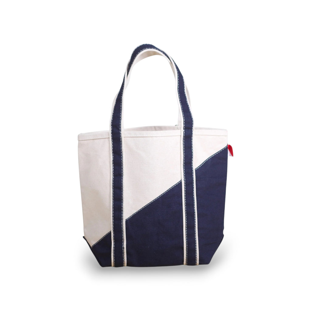ShoreBags Mini Contemporary Canvas Tote bag with off-white and navy blue diagonal design and navy blue handles.