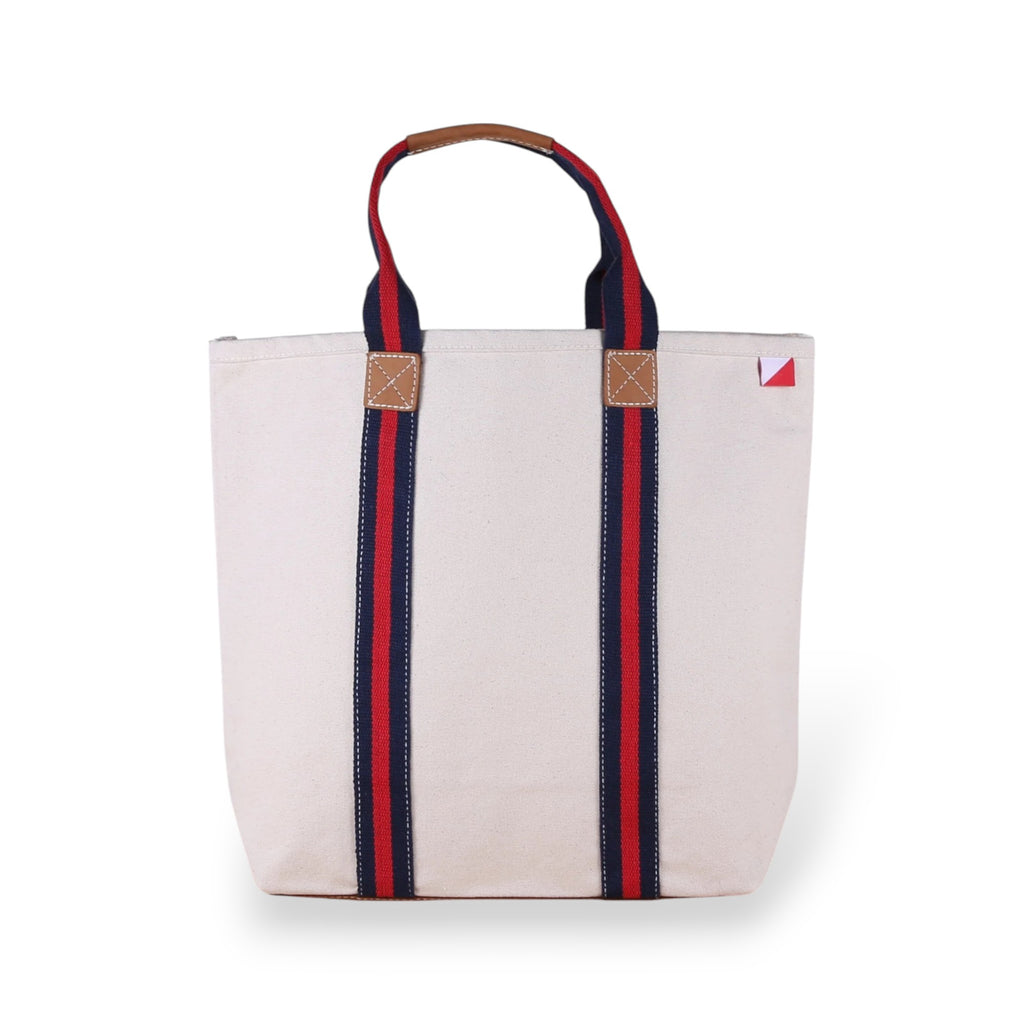 ShoreBags Society Canvas Tote bag with navy and red striped and tan leather handles.