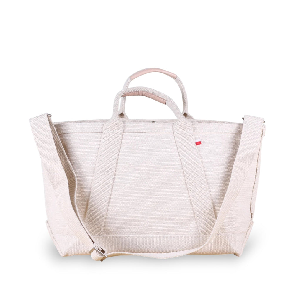 ShoreBags Utility Heavyweight Canvas Tote bag with handles and an adjustable shoulder strap, featuring a red tag.